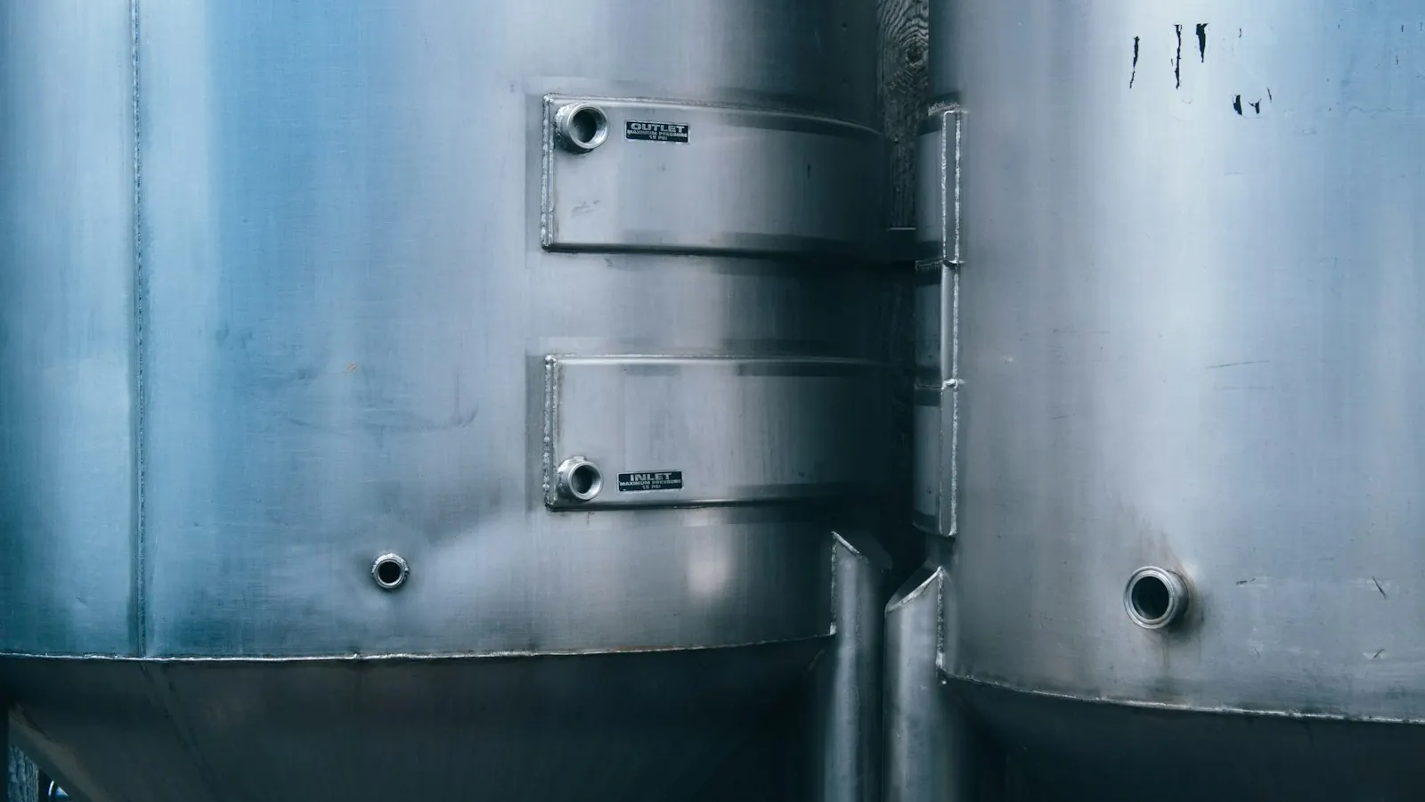 Stainless steel process tanks with inlet and outlet ports