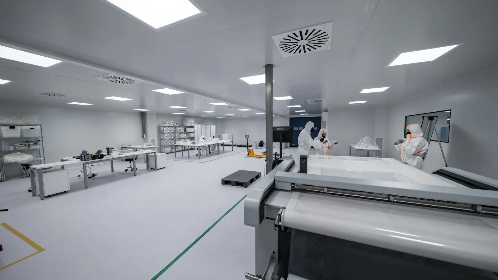 Cleanroom with technicians in protective suits